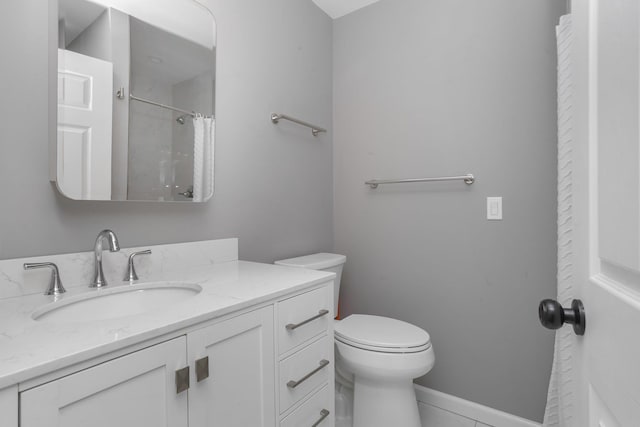 bathroom featuring a shower with shower curtain, vanity, toilet, and tile patterned flooring