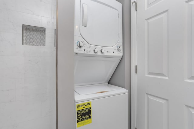 laundry area featuring stacked washer and dryer