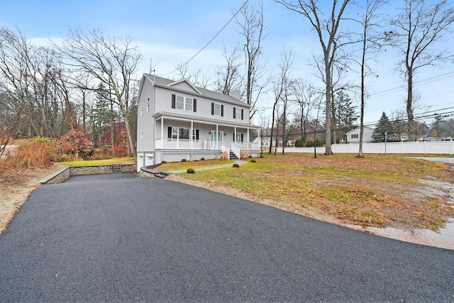 view of front of house featuring a front lawn and a porch