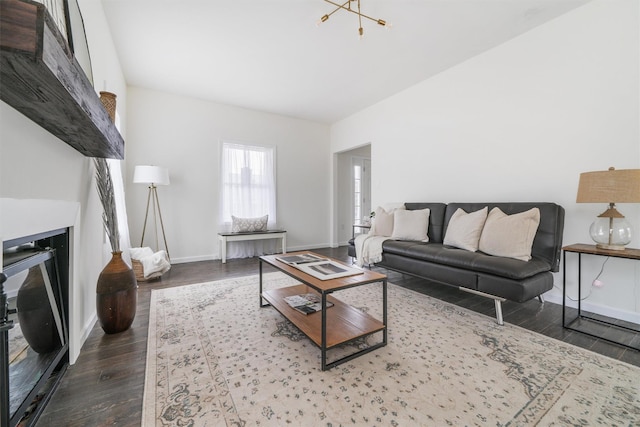 living room featuring dark hardwood / wood-style flooring and a notable chandelier