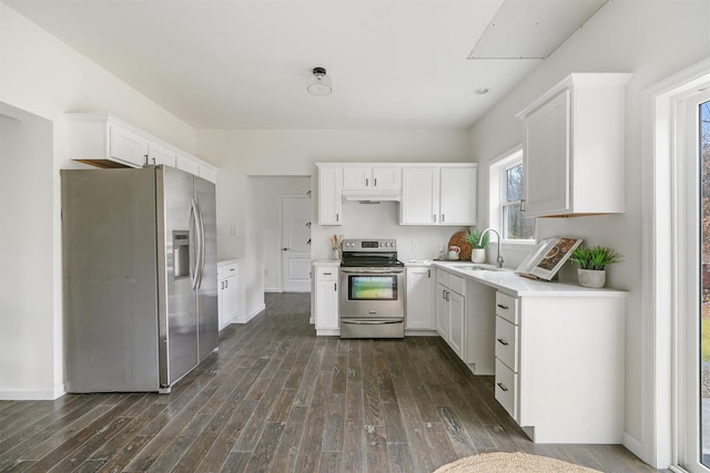 kitchen featuring white cabinetry, sink, dark hardwood / wood-style floors, and appliances with stainless steel finishes