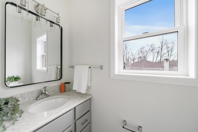 bathroom featuring vanity and a healthy amount of sunlight