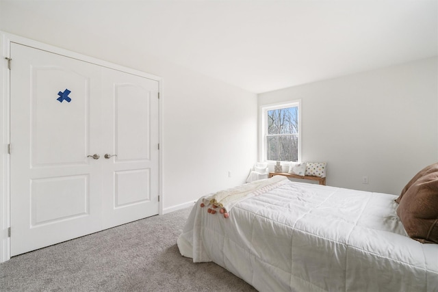 carpeted bedroom featuring a closet