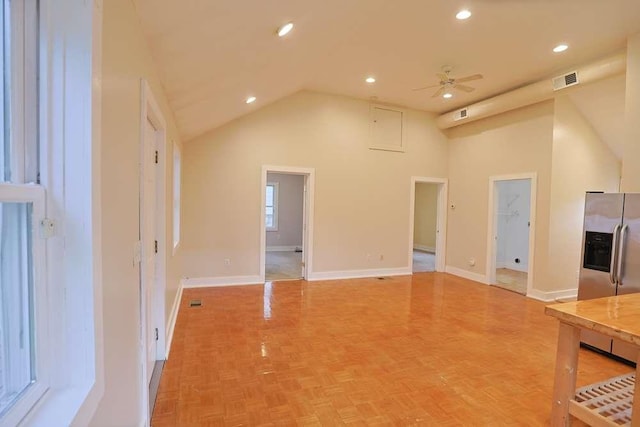 unfurnished living room featuring ceiling fan, parquet flooring, and high vaulted ceiling