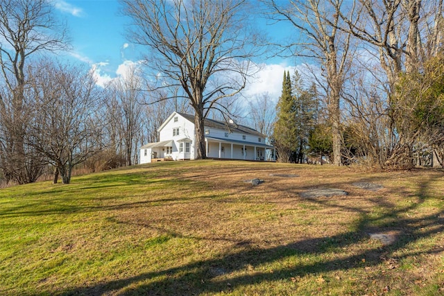 view of yard featuring covered porch