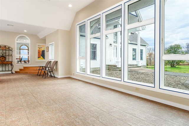 interior space with lofted ceiling and a healthy amount of sunlight