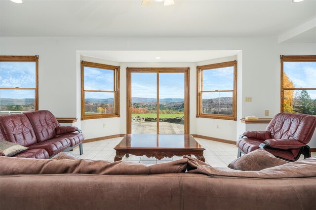 tiled living room featuring a mountain view