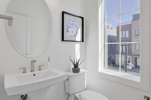 bathroom featuring toilet and a sink