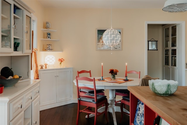 dining area featuring dark hardwood / wood-style floors