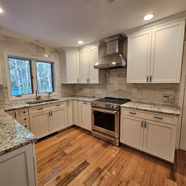 kitchen featuring white cabinetry, light stone countertops, and backsplash