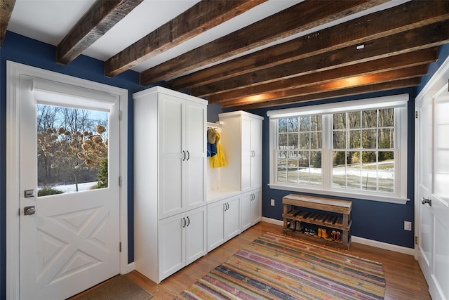 mudroom featuring light wood finished floors, beam ceiling, and baseboards