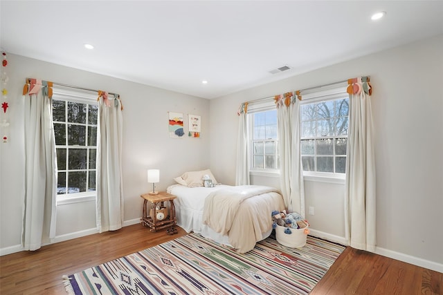 bedroom featuring recessed lighting, baseboards, and wood finished floors