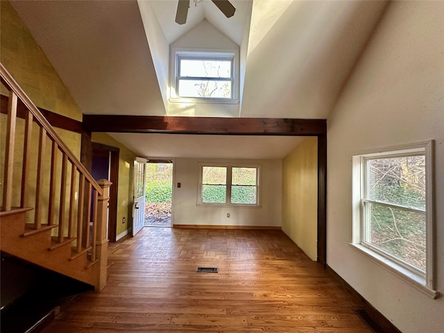 interior space with ceiling fan, plenty of natural light, high vaulted ceiling, and hardwood / wood-style flooring