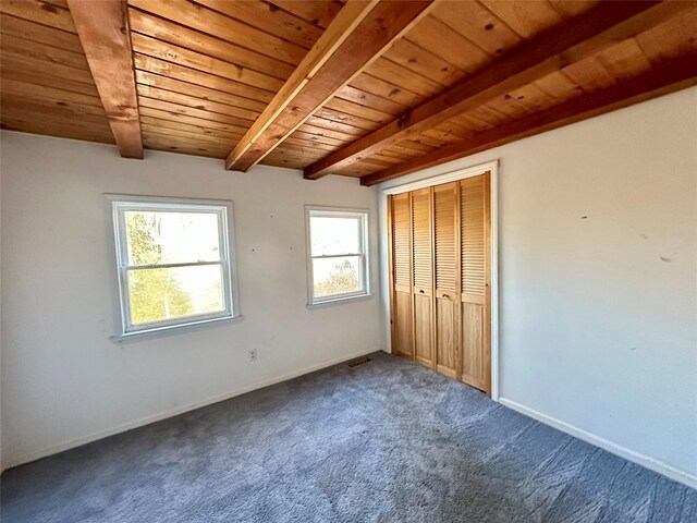 6 Hemlock Rd, South Salem, NY 10590 - unfurnished bedroom with wooden ceiling with exposed beams, dark colored carpet, baseboards, and a closet