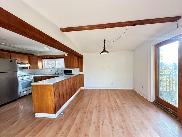 6 Hemlock Rd, South Salem, NY 10590 - kitchen featuring white appliances, brown cabinetry, a peninsula, light countertops, and light wood-type flooring