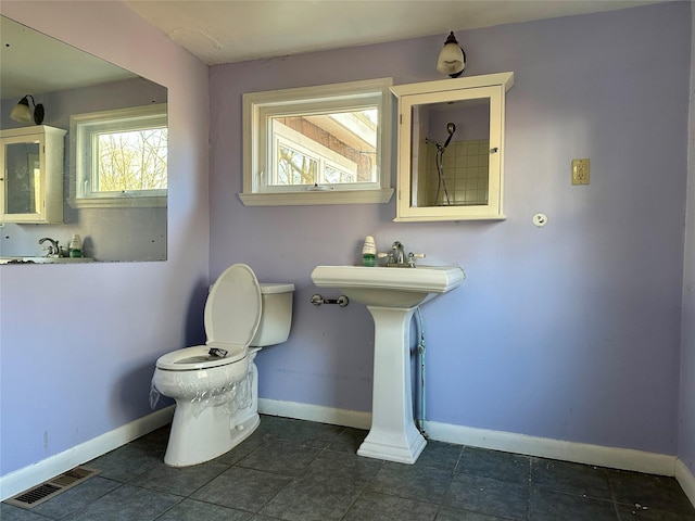 bathroom with tile patterned floors and toilet