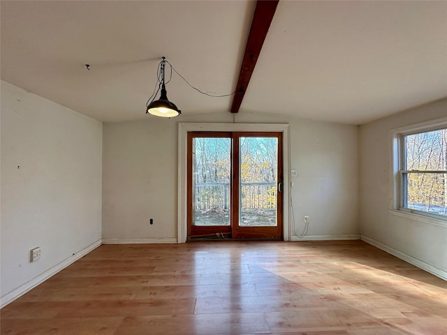 unfurnished dining area with light wood-type flooring and vaulted ceiling with beams