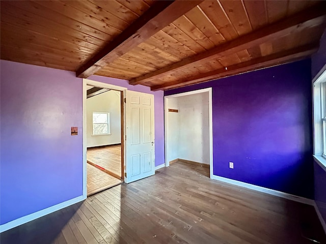 unfurnished bedroom with wooden ceiling, beamed ceiling, and wood-type flooring