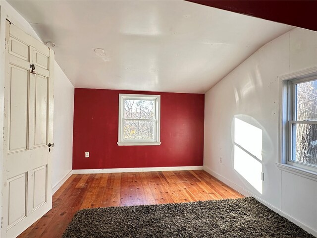 6 Hemlock Rd, South Salem, NY 10590 - unfurnished bedroom featuring light wood-style flooring, multiple windows, baseboards, and lofted ceiling