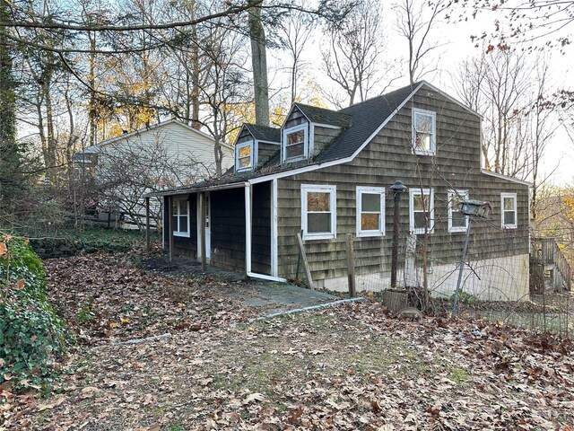 6 Hemlock Rd, South Salem, NY 10590 - rear view of property featuring roof with shingles