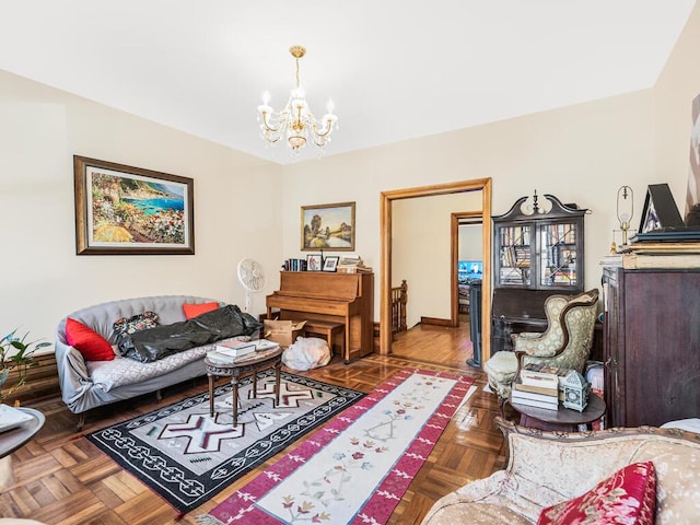 living room featuring parquet floors and an inviting chandelier