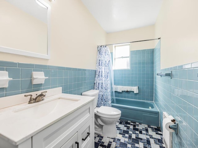 full bathroom featuring shower / tub combo, vanity, tile walls, tile patterned flooring, and toilet