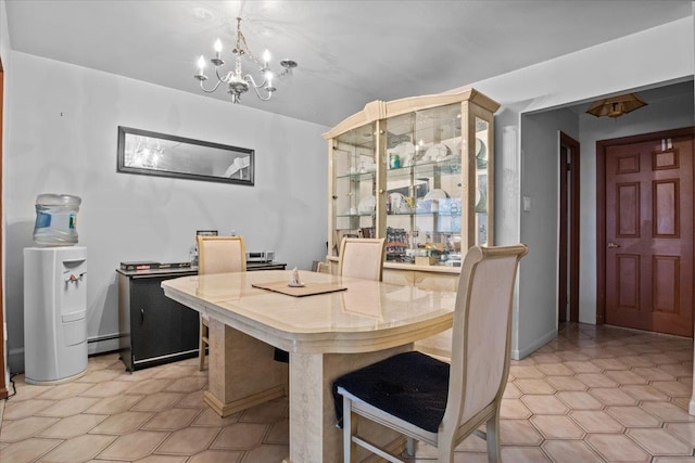 dining space with a notable chandelier and a baseboard heating unit