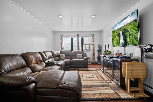 living room featuring crown molding and hardwood / wood-style flooring