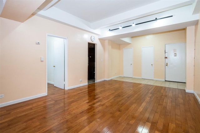 empty room featuring wood-type flooring