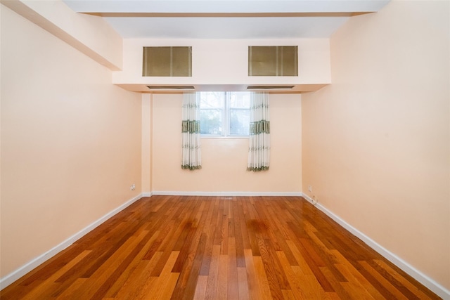 unfurnished room featuring wood-type flooring