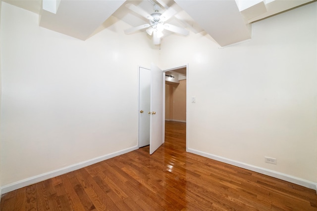 spare room featuring ceiling fan and hardwood / wood-style floors