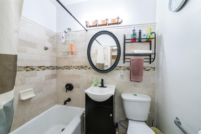 full bathroom featuring vanity, toilet, tile walls, and shower / bath combo with shower curtain