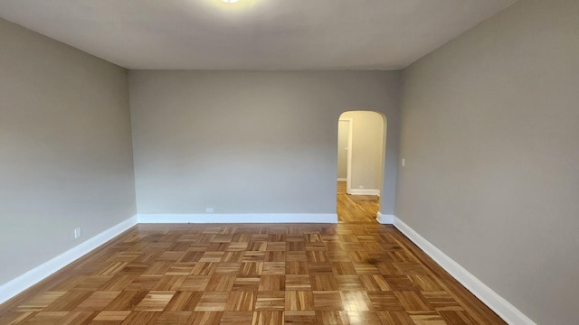 empty room with light parquet floors