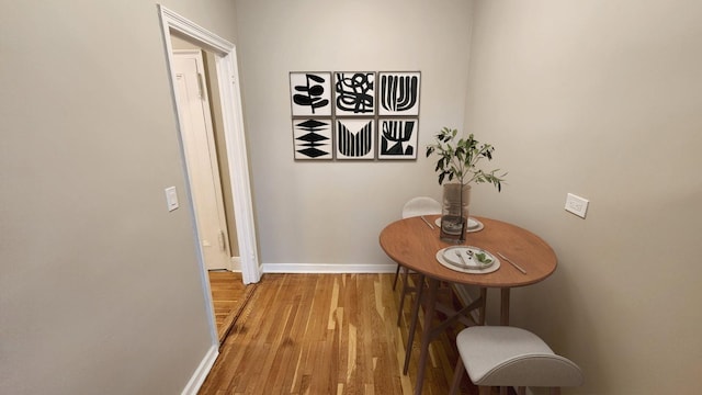 hallway with light hardwood / wood-style flooring