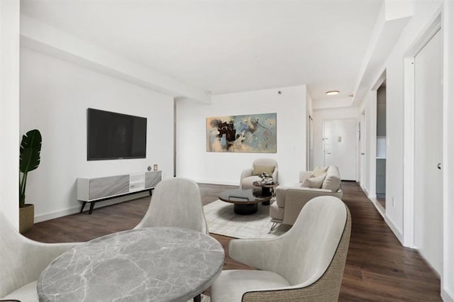 dining space with dark hardwood / wood-style flooring