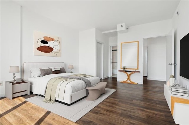 bedroom featuring dark hardwood / wood-style flooring