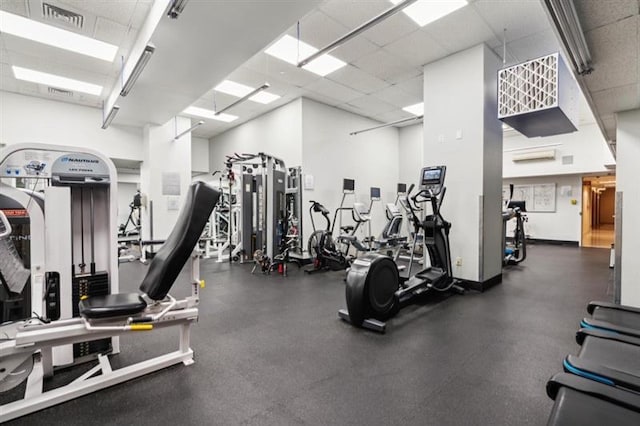 exercise room with a drop ceiling