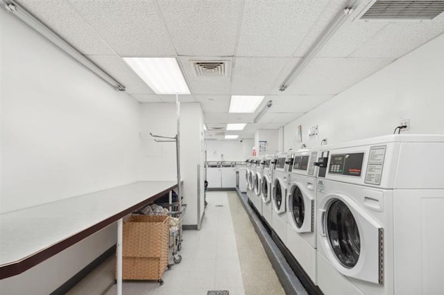 clothes washing area featuring separate washer and dryer