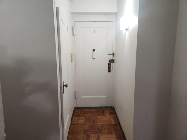 entryway featuring dark parquet floors