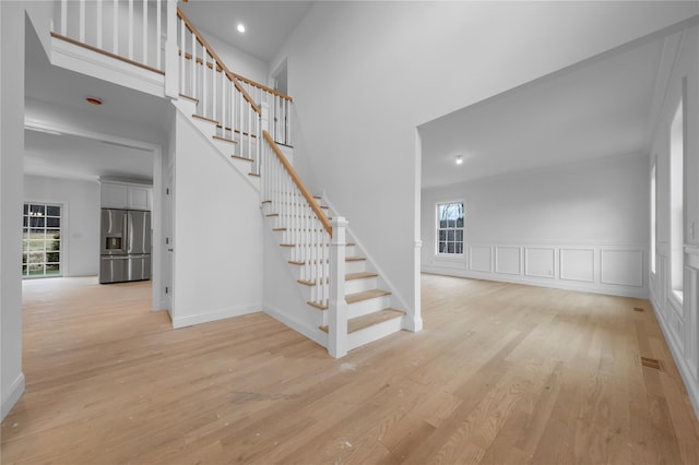 staircase featuring wood-type flooring