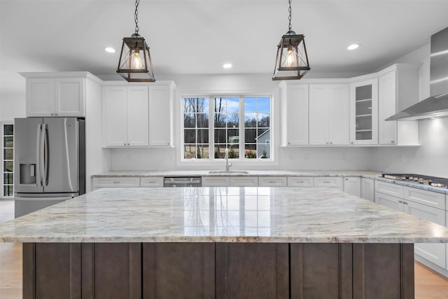 kitchen with white cabinets, appliances with stainless steel finishes, and sink