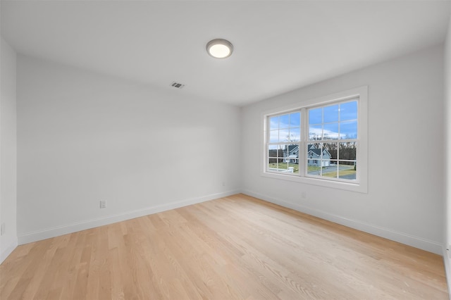 spare room with light hardwood / wood-style floors