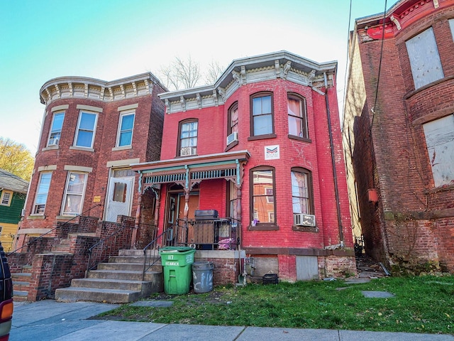 italianate-style house featuring cooling unit