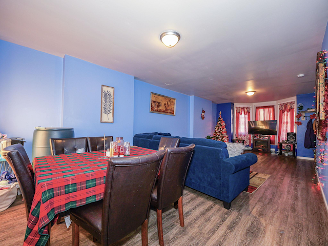 dining room with wood-type flooring