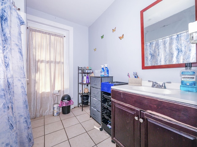 bathroom with tile patterned floors and vanity