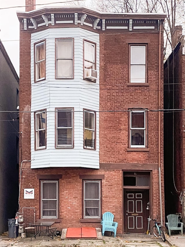 view of front of property featuring cooling unit