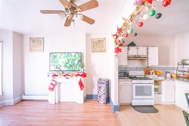 kitchen with tasteful backsplash, white cabinetry, white range, and light wood-type flooring