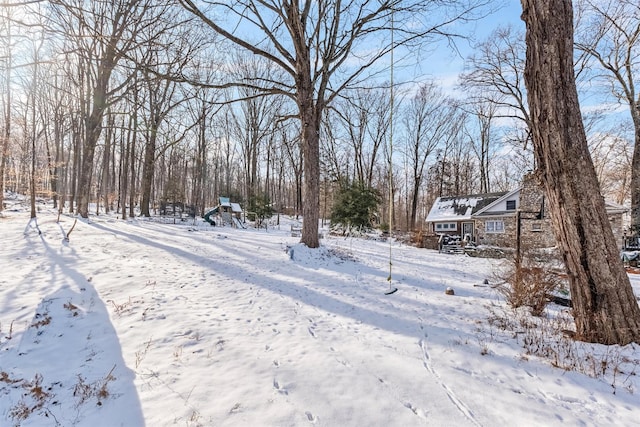 view of yard layered in snow