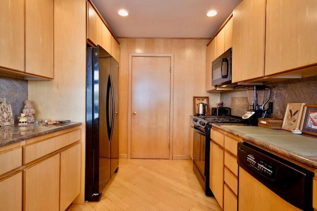 181 Starlight Rd, Monticello, NY 12701 - kitchen with light brown cabinetry, decorative backsplash, black appliances, and light wood-type flooring