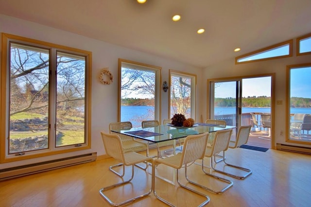 181 Starlight Rd, Monticello, NY 12701 - dining space with recessed lighting, lofted ceiling, a water view, a baseboard heating unit, and hardwood / wood-style flooring